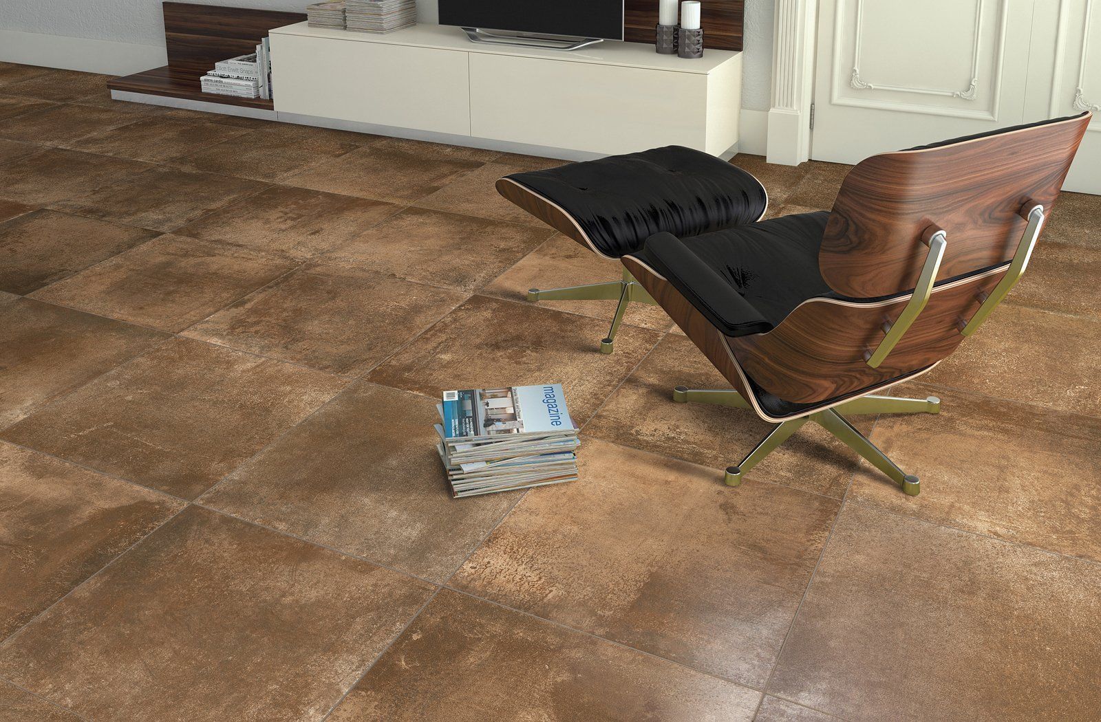 A chair and ottoman are sitting on a tiled floor in a living room.