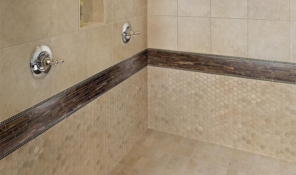 A bathroom with a shower and a tiled floor