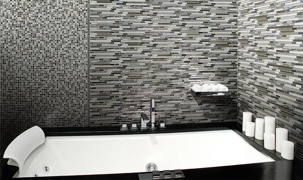 A black and white photo of a bathroom with a bathtub and candles.