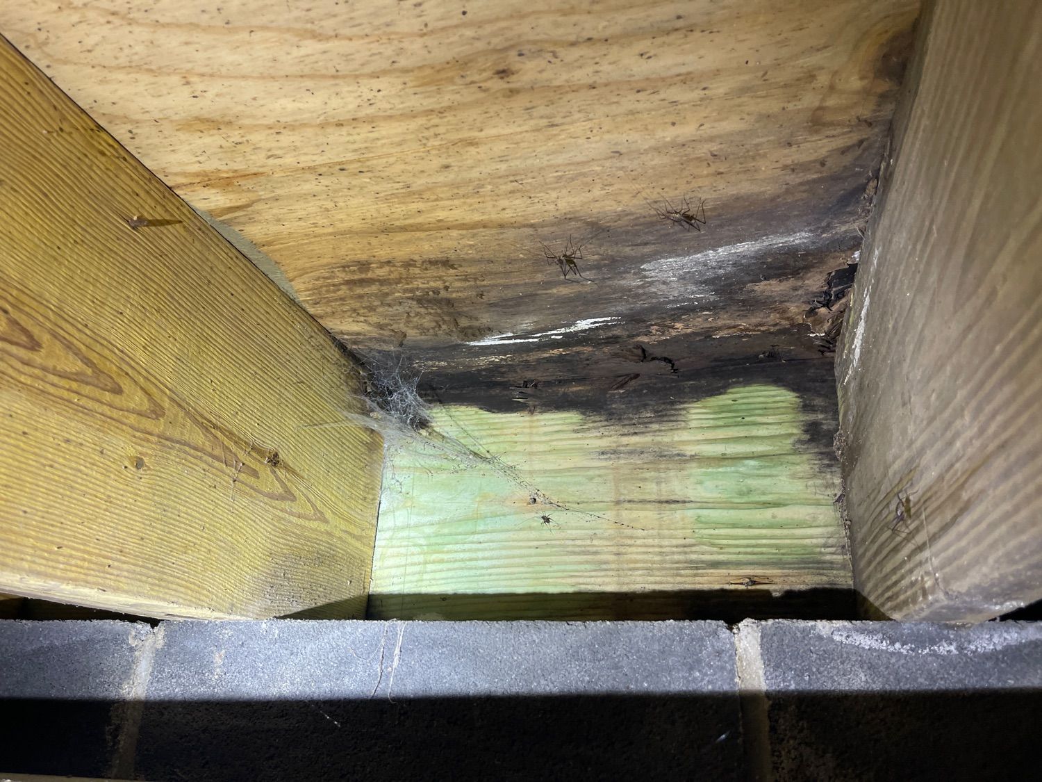 A close up of a wooden beam in a room.