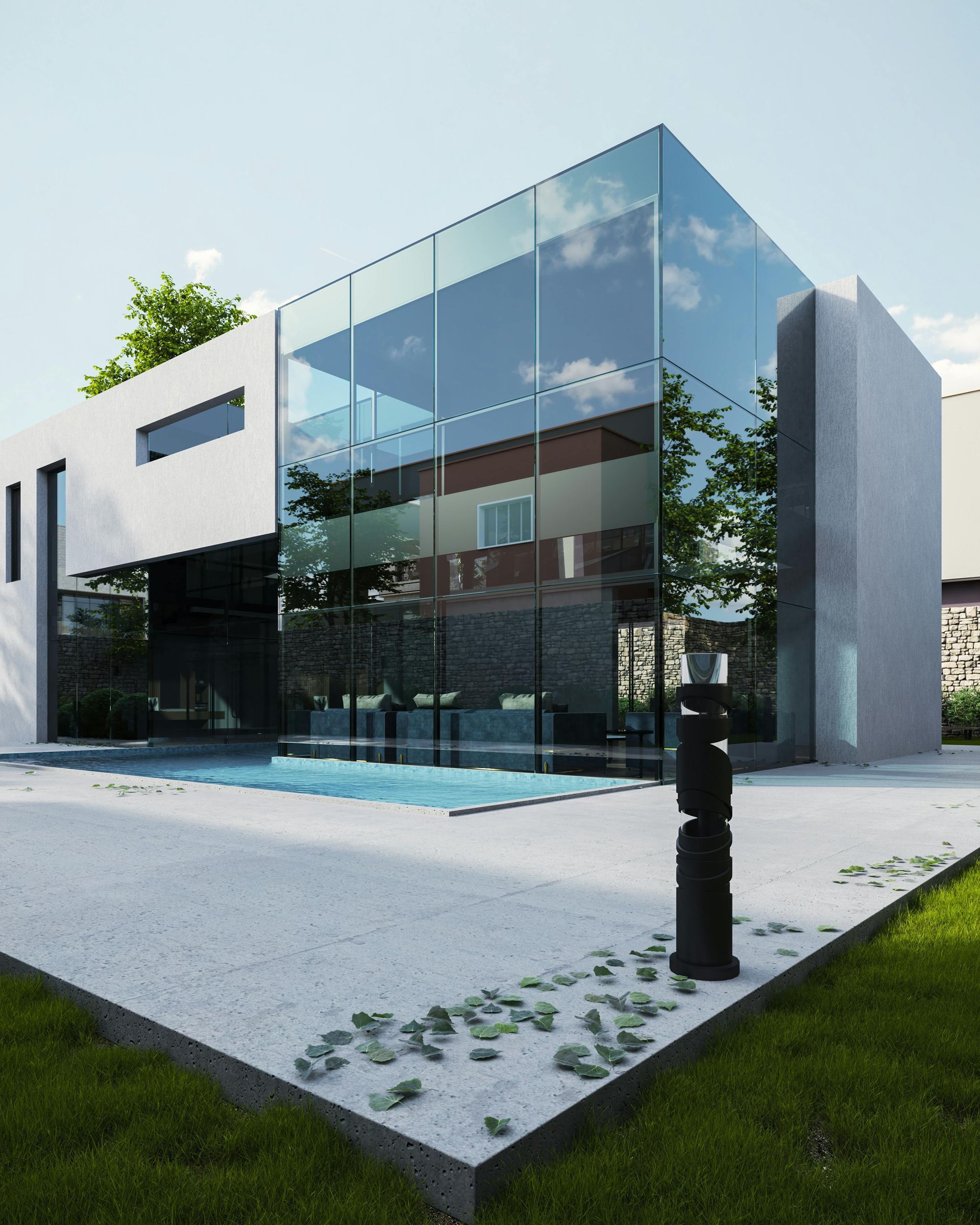 Modern glass house with a pool and lush lawn under a clear sky.