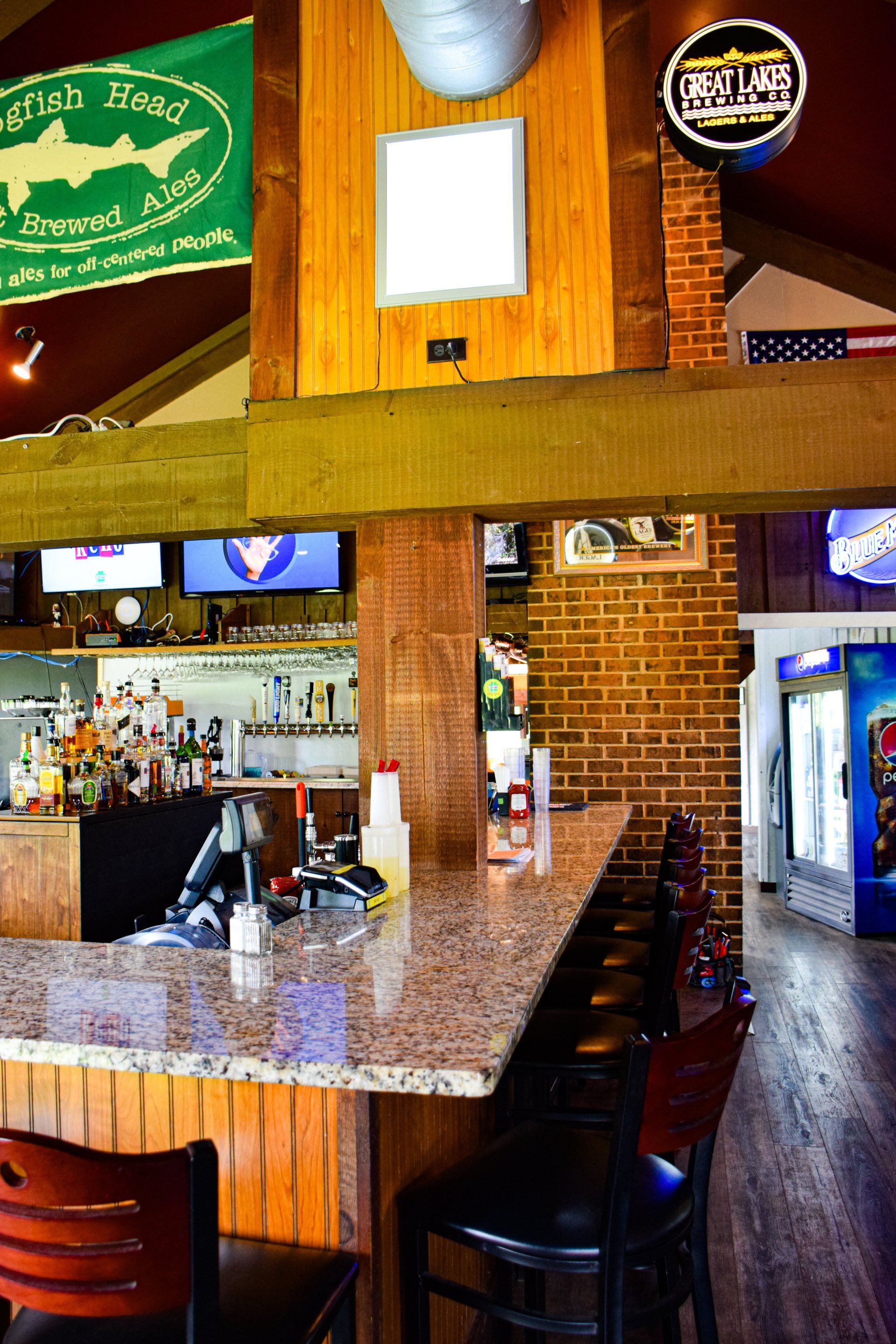A bar with a sign that says ' shark brewery ' on it