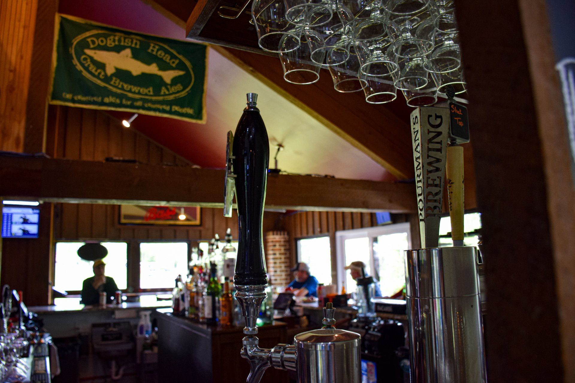 A bar with a beer tap that says brewing on it