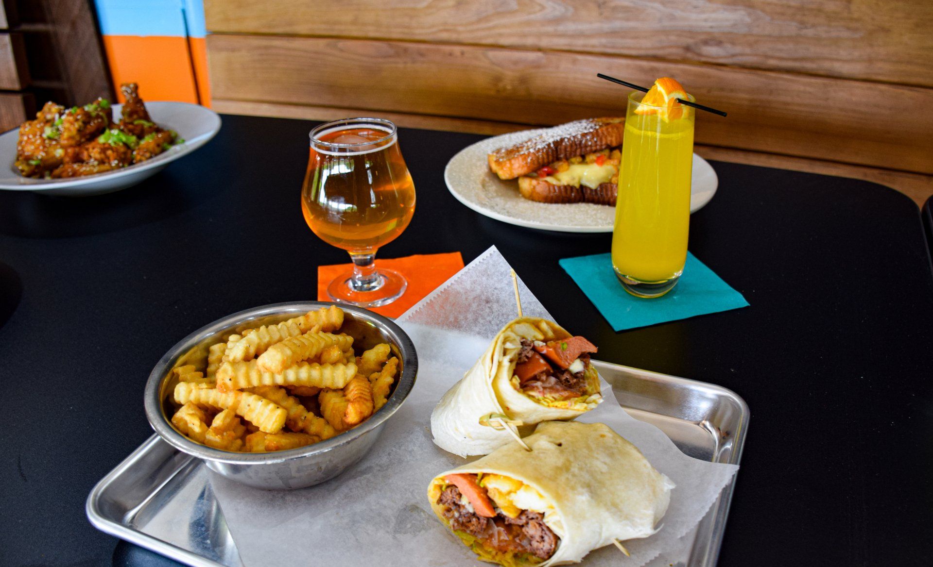 A tray of food and drinks on a table.