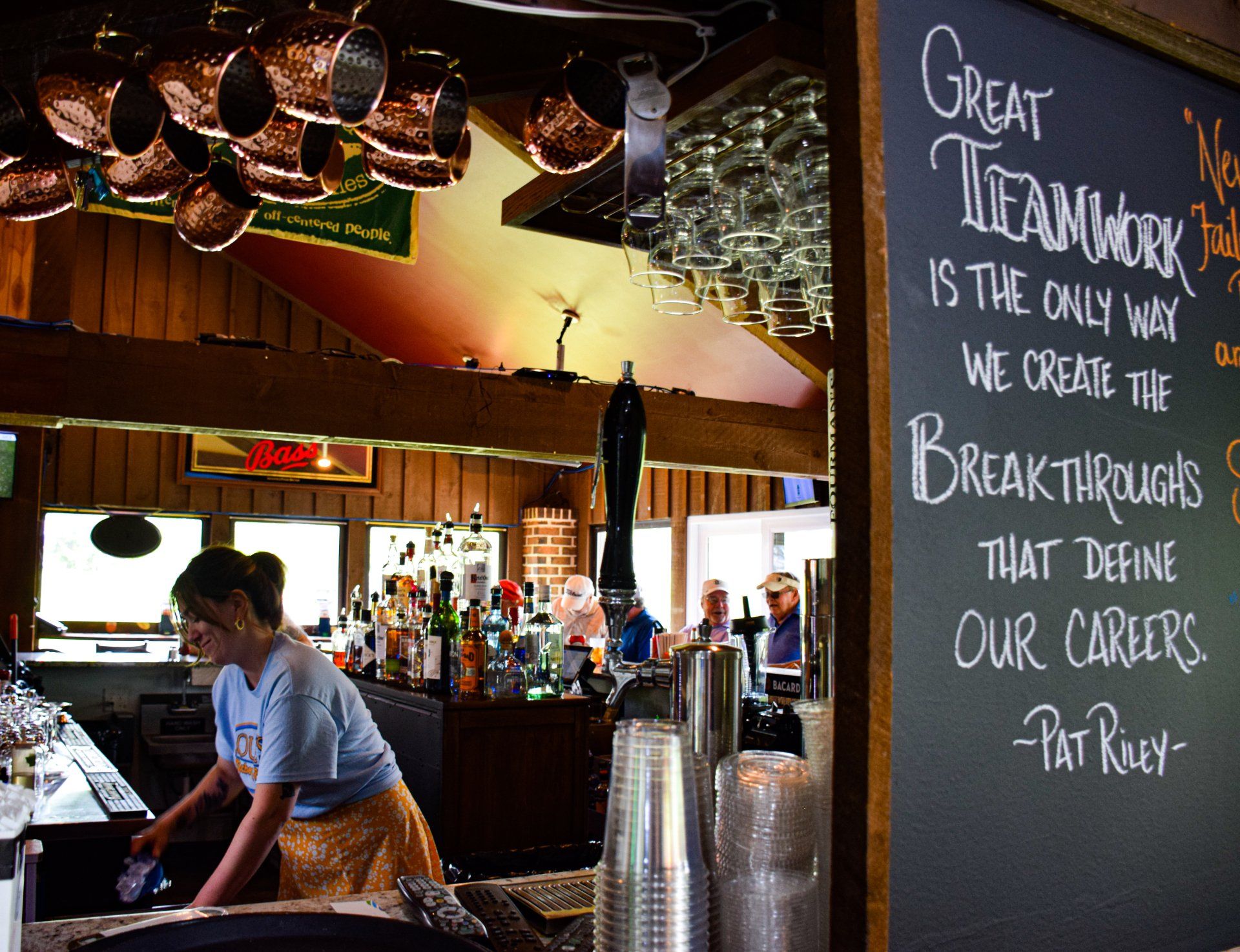A chalkboard says great teamwork is the only way we create the breakthroughs that define our careers