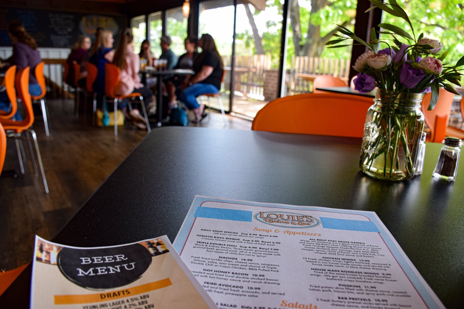A menu is sitting on a table in a restaurant