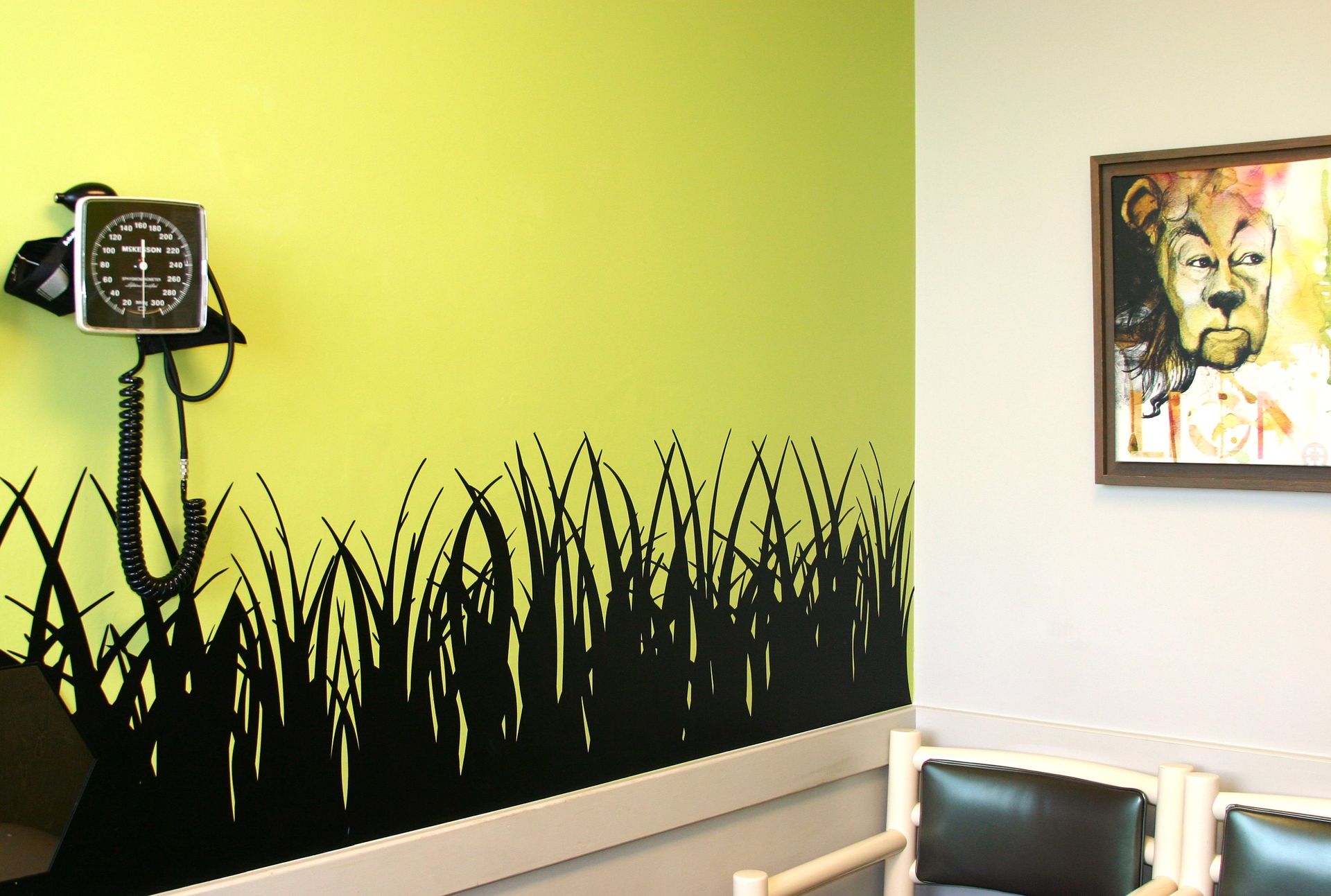 A waiting room with a picture of the wizard of oz on the wall