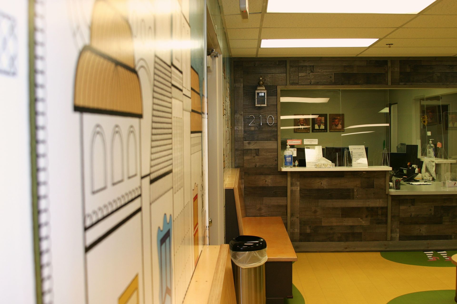 A room with a drawing of a building on the wall.