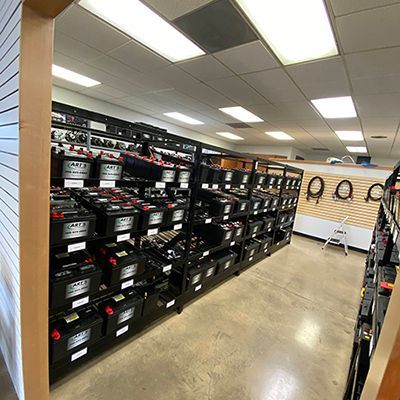 auto batteries on shelves | Art's Automotive