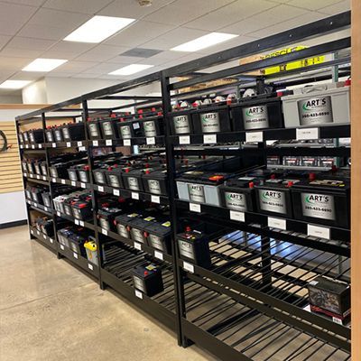 auto batteries on shelves | Art's Automotive