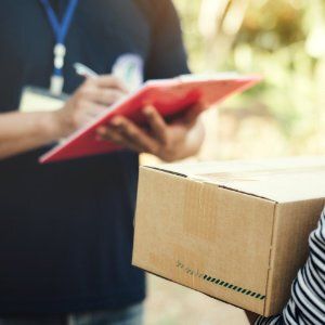 courier driver delivering packages to a person