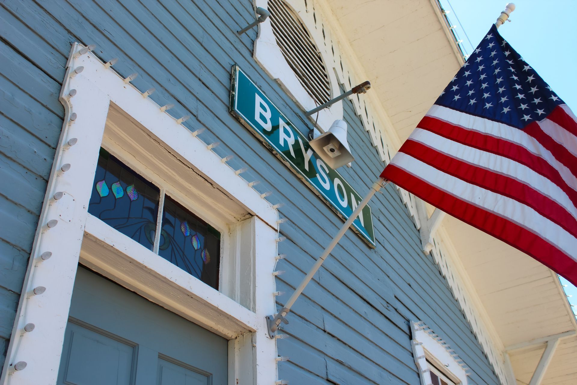Blue building with white trim, the word