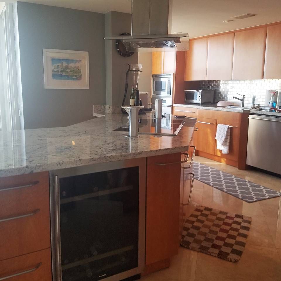 A kitchen with stainless steel appliances and granite counter tops