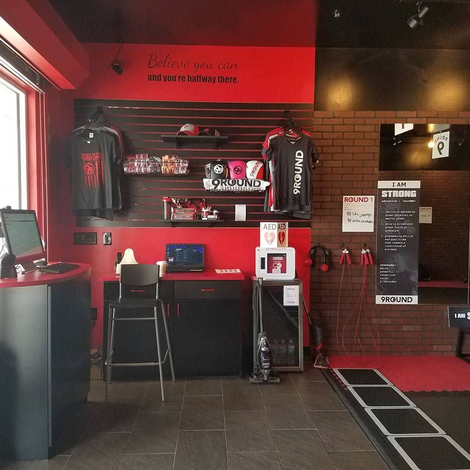 A room with a red wall and a sign that says 