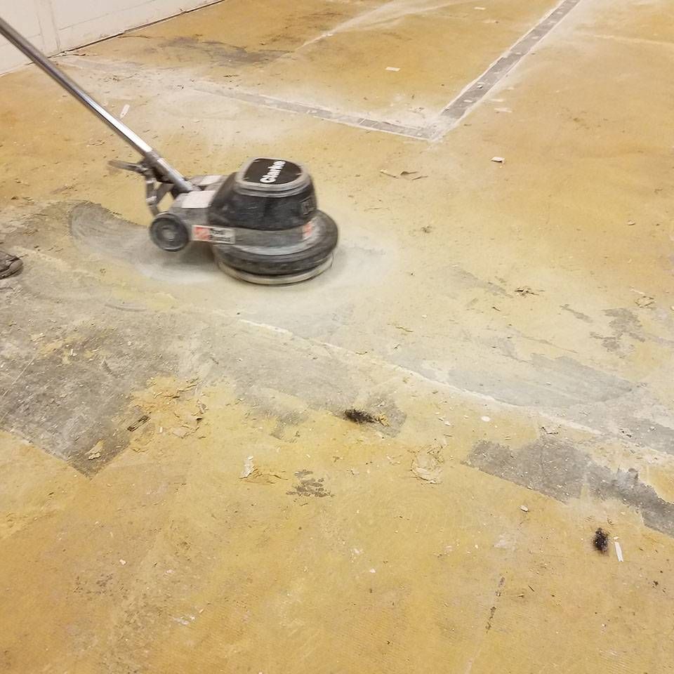 A machine is being used to clean a dirty floor