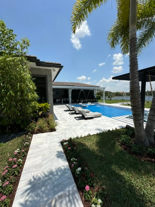 A house with a large swimming pool in the backyard