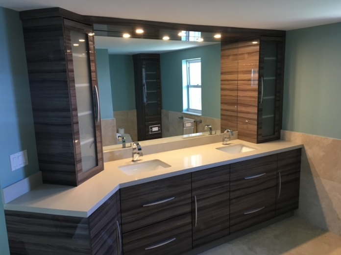 A bathroom with two sinks and a large mirror