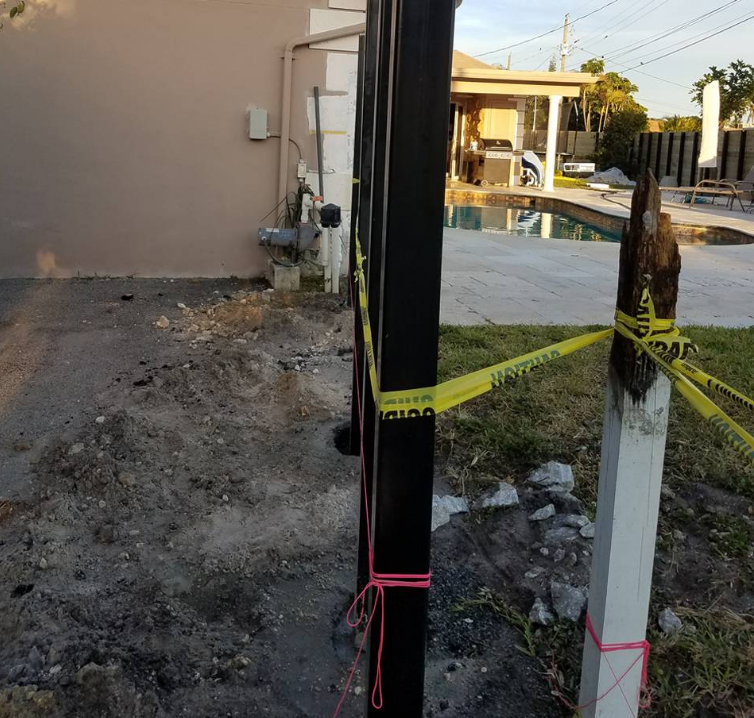 A fence with a caution tape around it
