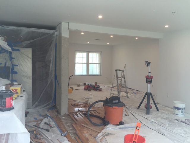 A room that is being painted with a vacuum cleaner