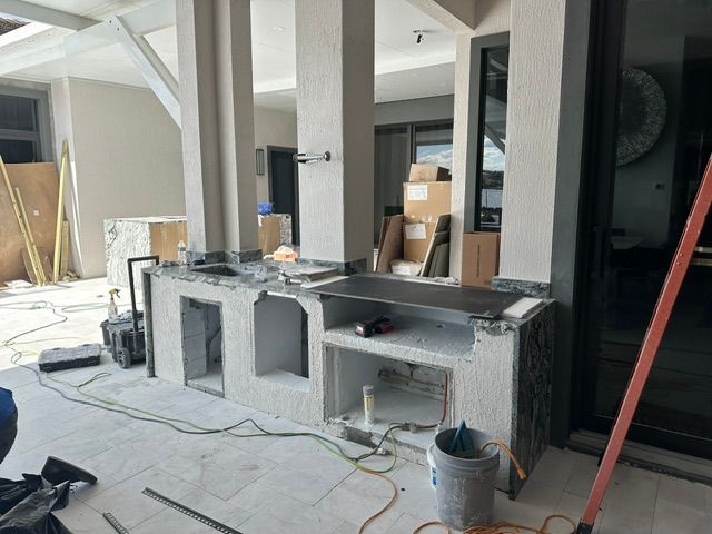 A kitchen is being built in a house.