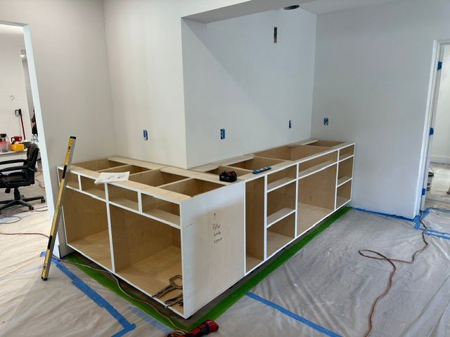 A kitchen is being remodeled and the cabinets are being built