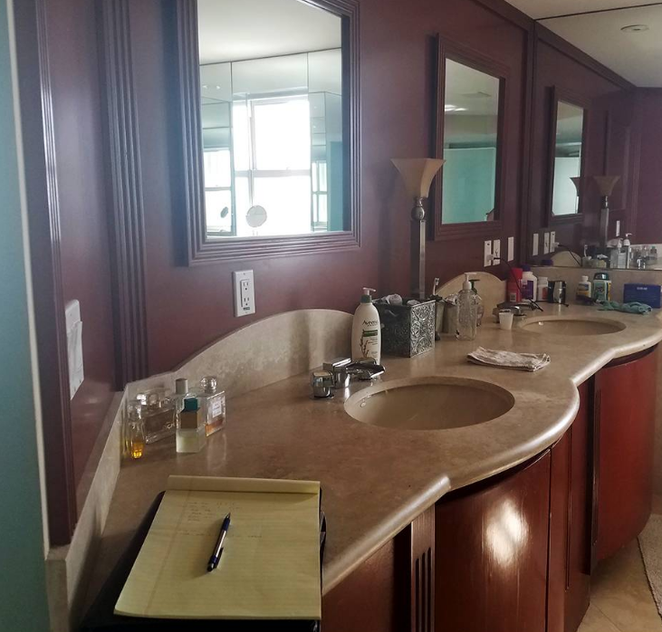 A bathroom with two sinks and two mirrors