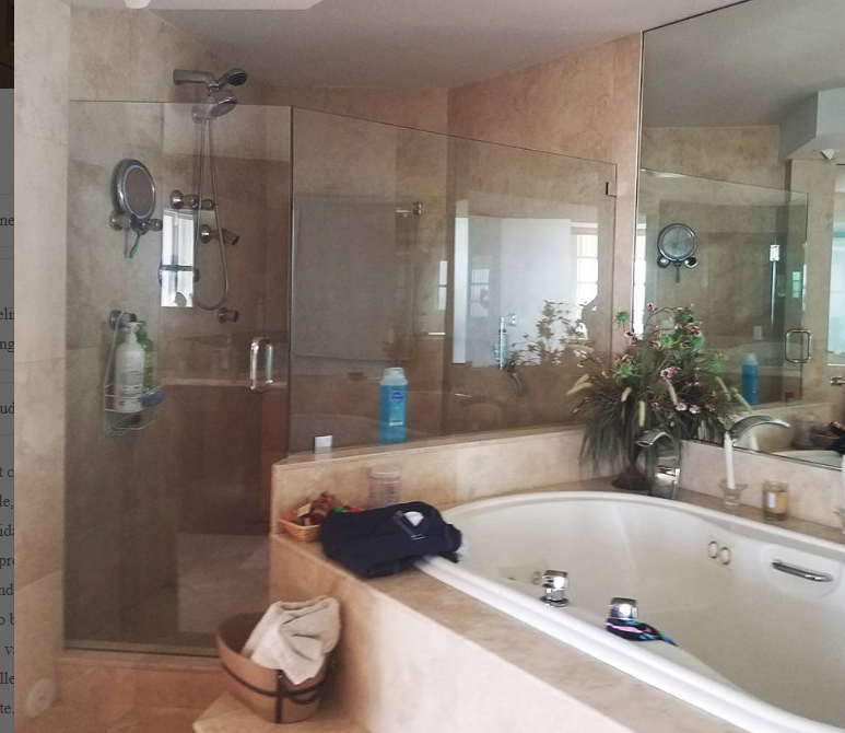 A bathroom with a jacuzzi tub and a walk in shower