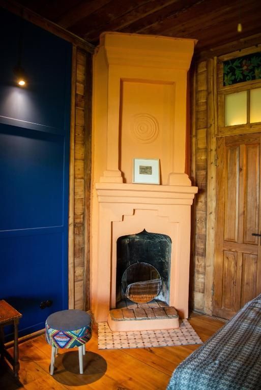 There is a fireplace in the middle of the room.