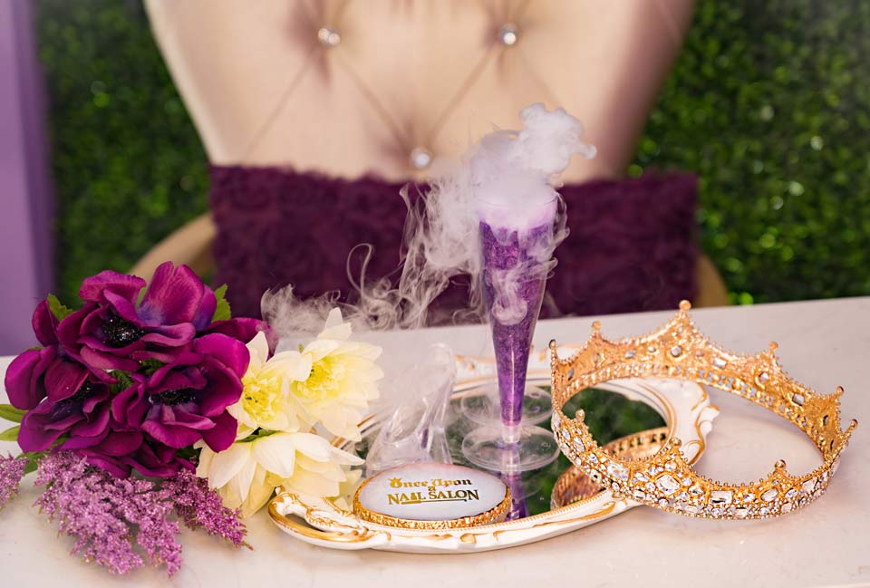 magic potion drink on table with crown and flowers