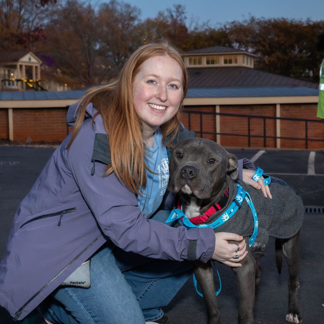 volunteer manager holding a dog