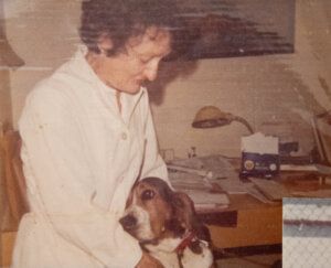 old photo of woman holding dog