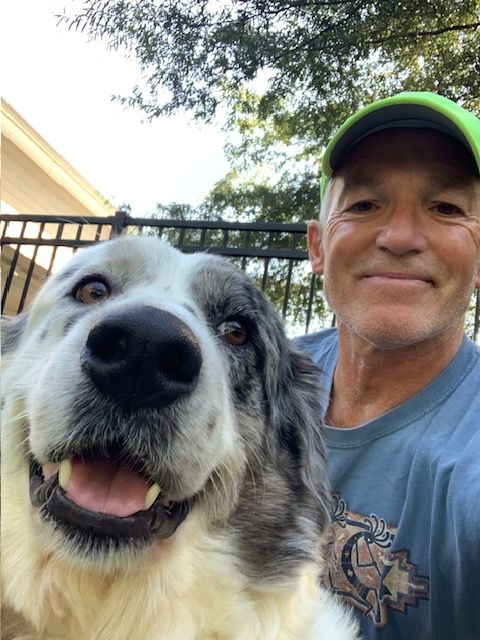 up close photo of man and dog