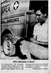 Photo of former SPCA director Ian Lochheead sitting in front of the SPCA's animal ambulance