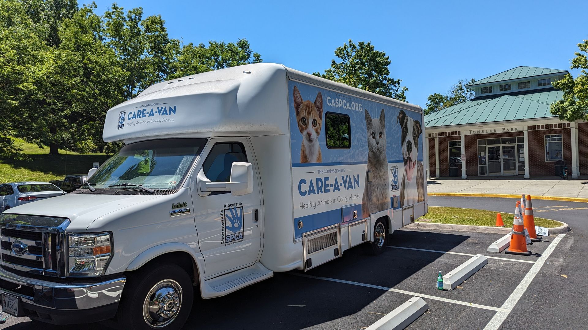 Photo of the Compassionate Care-A-Van mobile veterinary clinic, parked in a local community park