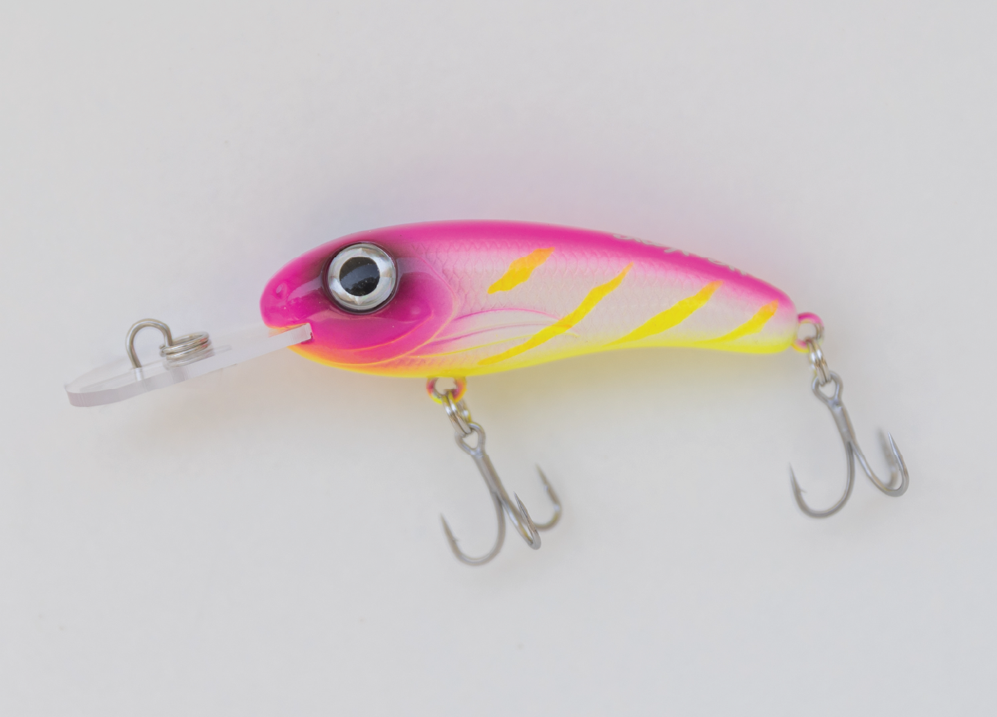 Pink and yellow fishing lure with two treble hooks and a clear plastic lip.