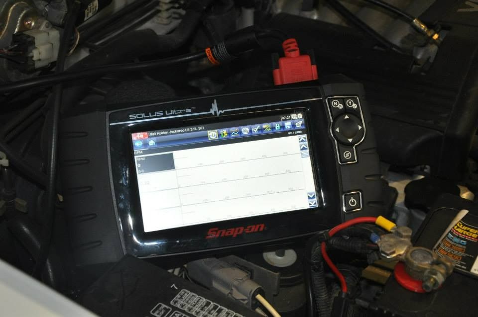 A Snap On Device Is Sitting Under The Hood Of A Car — Advanced Automotive Services In Cairns, QLD