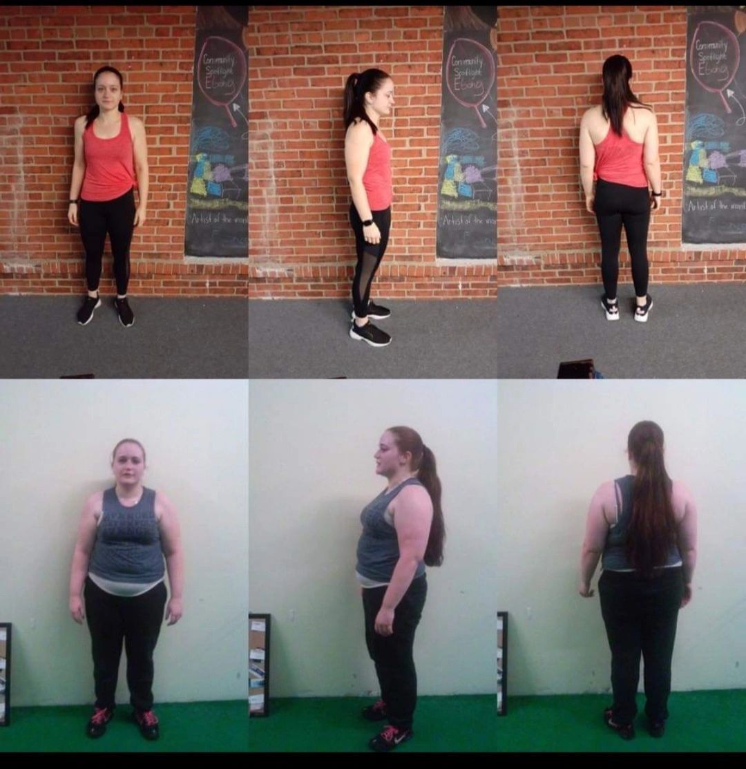 A woman in a red tank top is standing in front of a brick wall