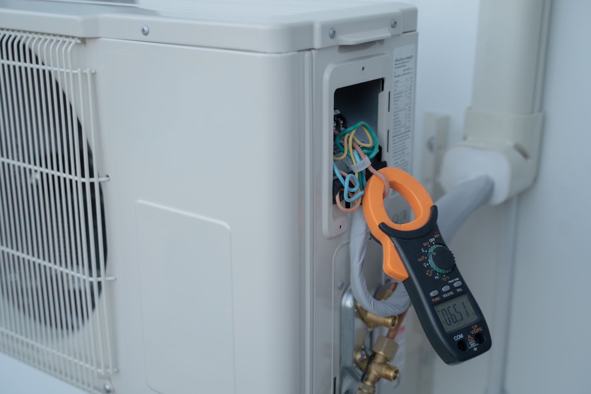 White AC Unit with Open Access Panel — Breezy Point, MN — JM Heating & Air White AC Unit with Open Access Panel — Breezy Point, MN — JM Heating & Air