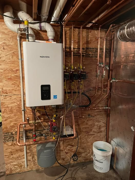 Person Working on Air Conditioning Unit — Breezy Point, MN — JM Heating & Air