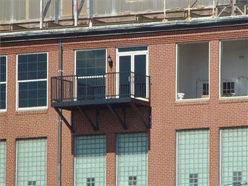 Metal Balcony Installation — Rectangular Balcony of a Brick Building in Winston-Salem, NC