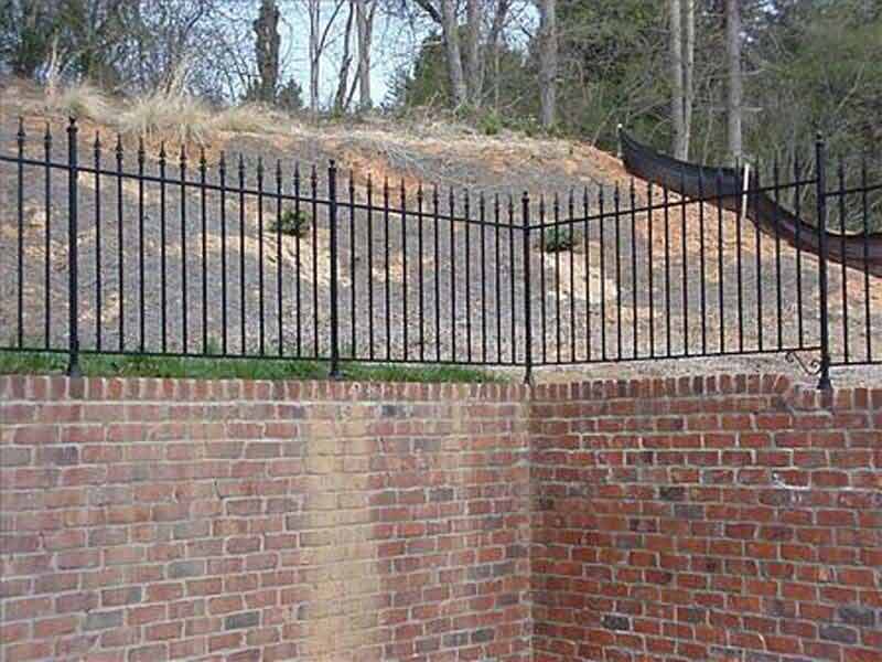Custom Fence Installation — High Fence of a Brick Wall in Winston-Salem, NC