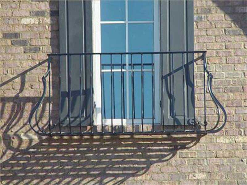 Metal Balcony Designs — Curved Balcony with a Small Window in Winston-Salem, NC