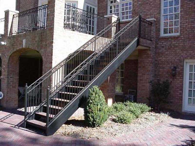 Iron Railing Designs — Long Staircase of an Apartment in Winston-Salem, NC