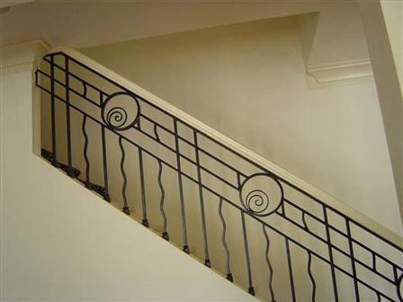 Interior Iron Railing — Iron Staircase with Spiral Design in Winston-Salem, NC