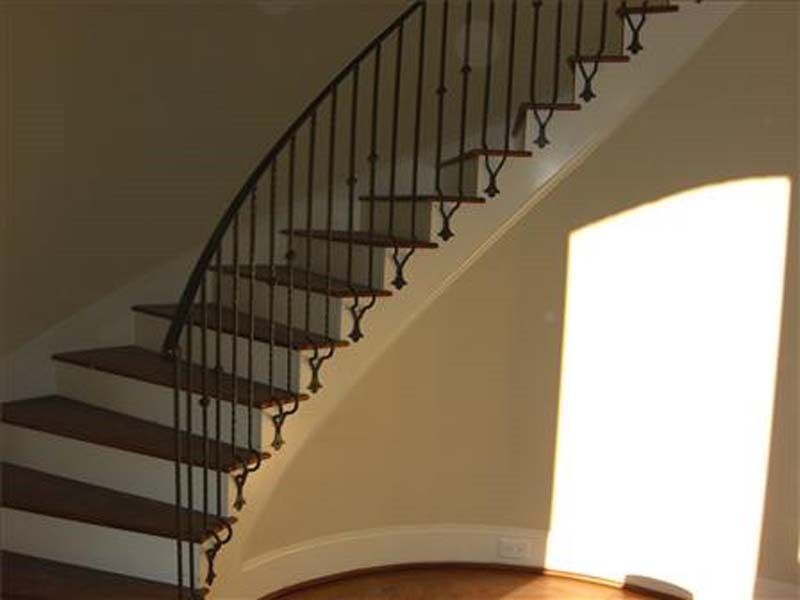 Iron Railings — Curved Staircase Inside a House in Winston-Salem, NC
