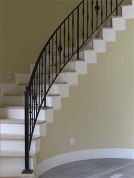 Curved Staircase — Stairs with Iron Hand Railings in Winston-Salem, NC