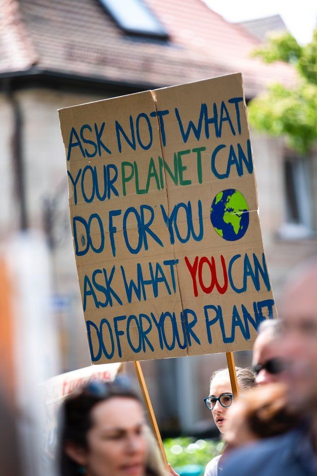 Image of climate protests and school strike placard for global climate change action