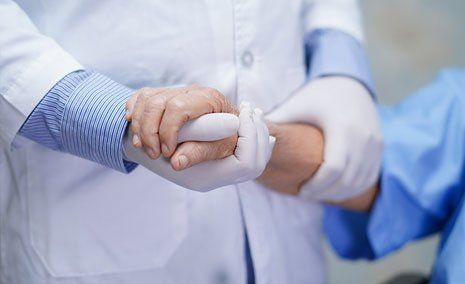 Medical Staff Holding Patient Hand — West Monroe, LA — Medical Temps, Inc.