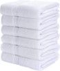 A stack of white towels sitting on top of each other on a white background.