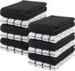A stack of black and white towels stacked on top of each other.